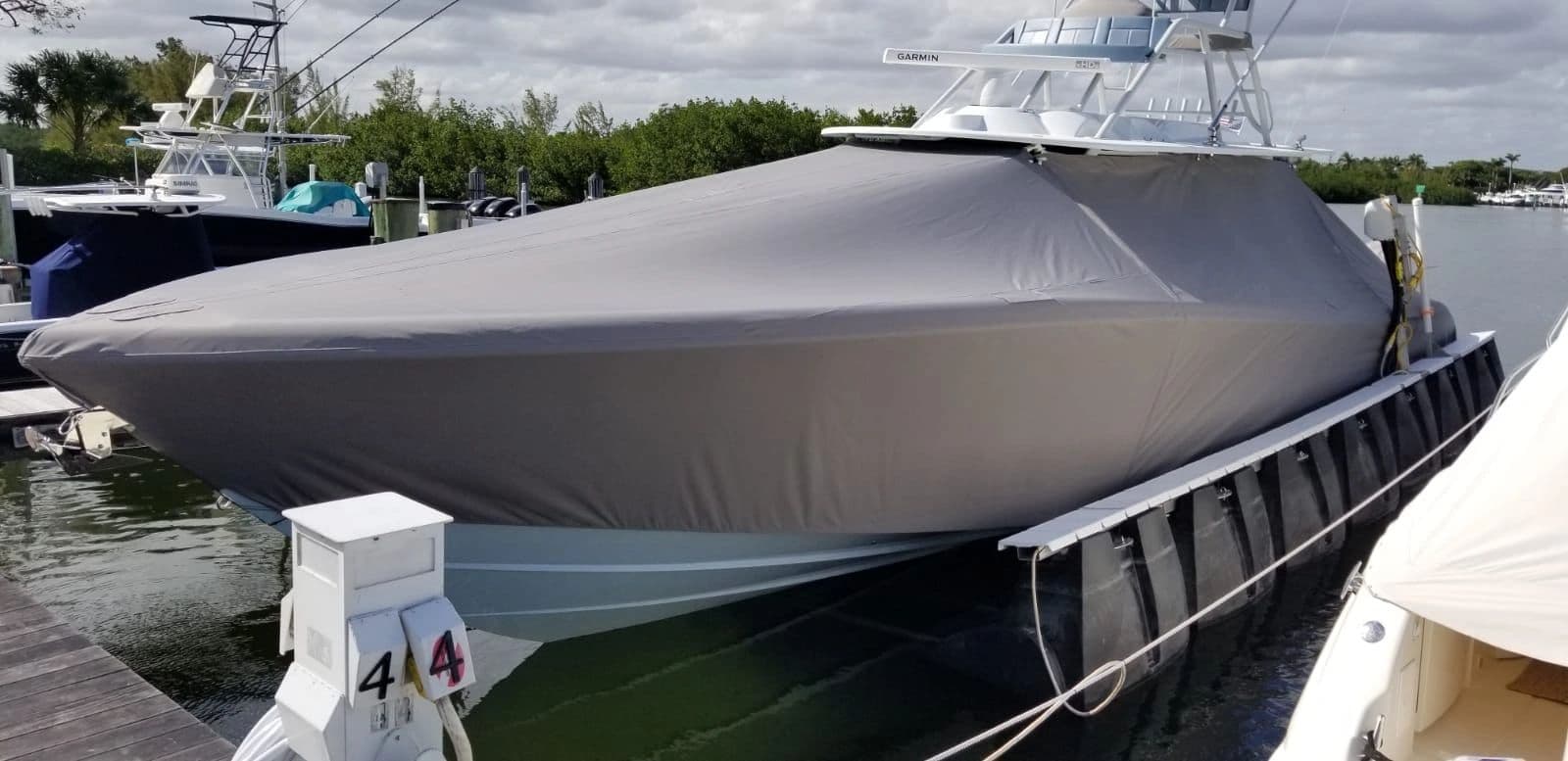 Charcoal full cover on a tower boat at the marina