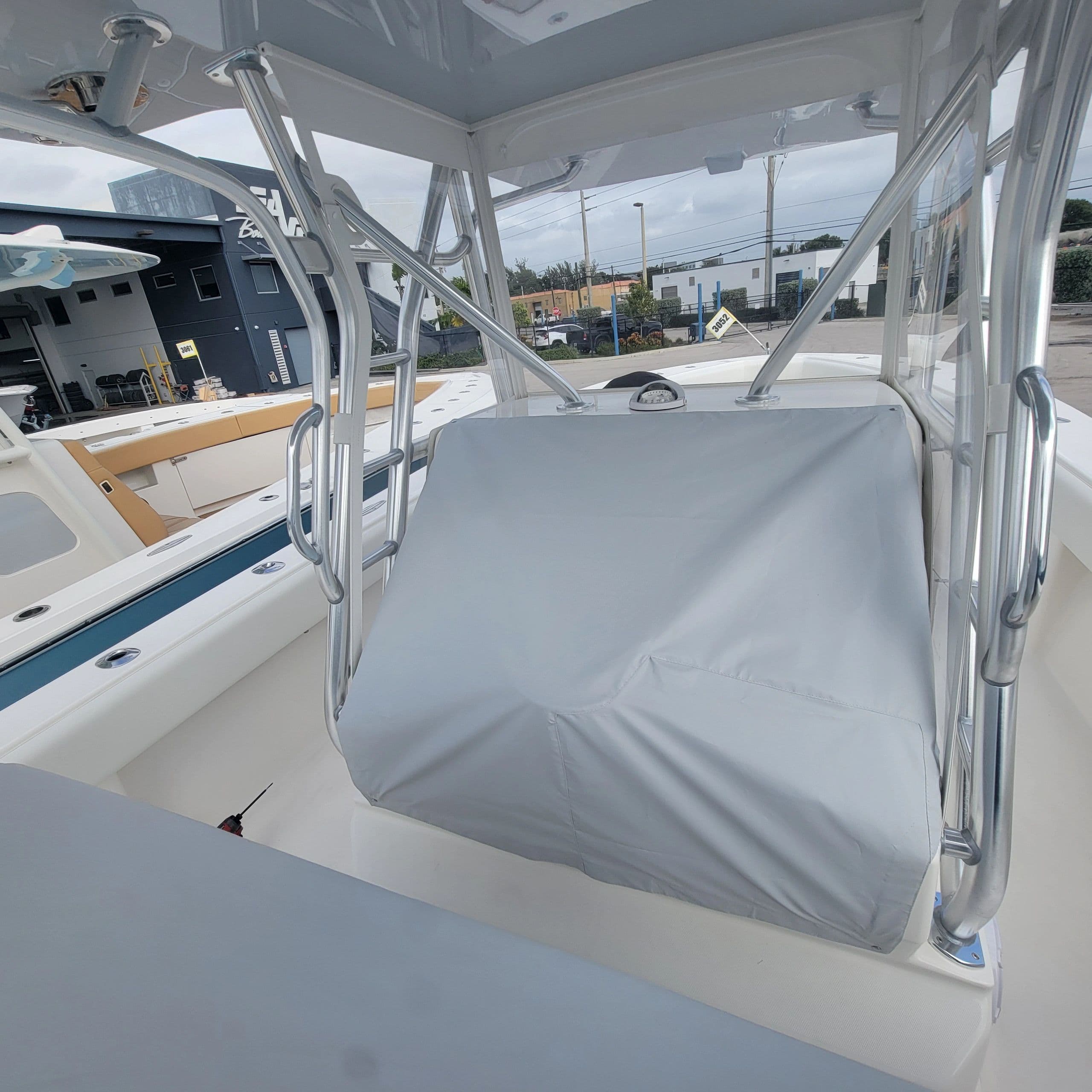 Fitted grey console and seat cover under a center console T-top — Canvas Craft's own work
