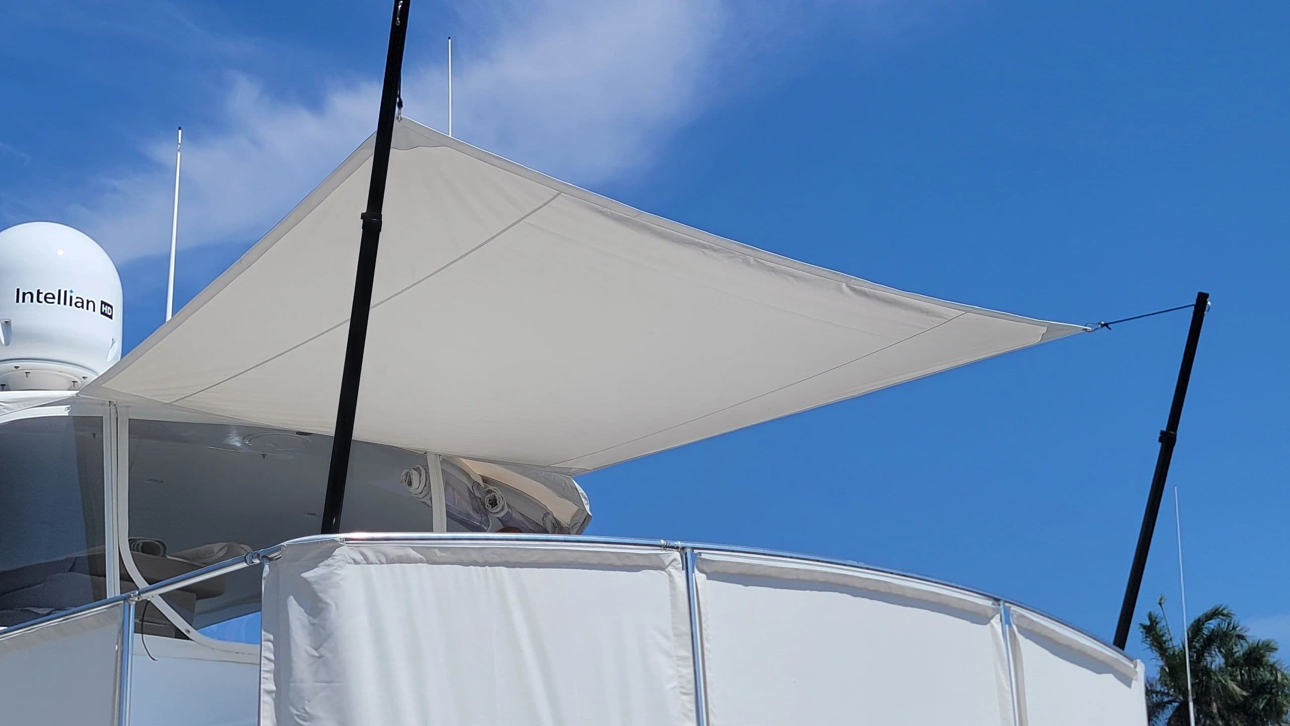White canopy shade over a motor yacht flybridge